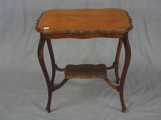 An Edwardian oval walnutwood 2 tier occasional table, raised on cabriole supports 26"