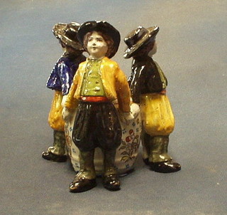 A 19th Century French Quimper bowl supported by 3 standing figures (f and r) the base marked St Malo