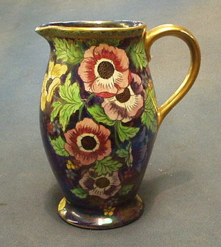 A Malingware blue lustre pottery jug with floral decoration the base marked 6385A 8"  and a  white glazed Devon gurgling fish jug