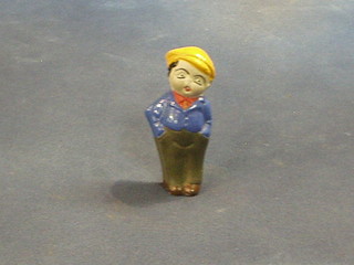 A Japanese pottery figure of a standing golfer 3 1/2"