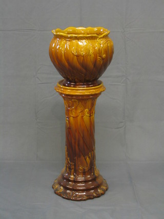 A pottery twin handled jardiniere and stand (slight chip to rim)