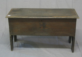 A 17th/18th Century oak coffer of panelled construction with hinged lid, the interior fitted a candle box 37"