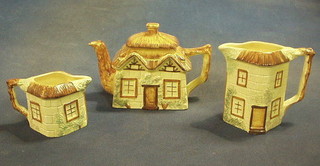 A Cottageware pottery 3 piece tea service with teapot and 2 cream jugs