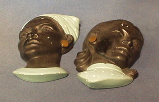 A pair of plaster wall masks 8"