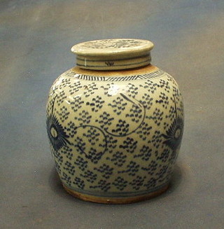 A 19th Century Oriental blue and white pottery ginger jar with lid (lid chipped) 7"