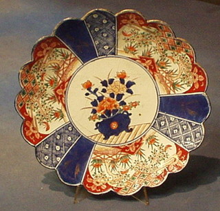 A circular 19th Century Imari porcelain bowl with lobed and panel decoration 12" (f and r)