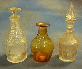 An amber coloured ring neck decanter and 2 decanters and stoppers