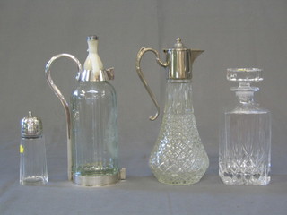 A cut glass spirit decanter, a moulded glass claret jug, a soda siphon holder and a sugar sifter