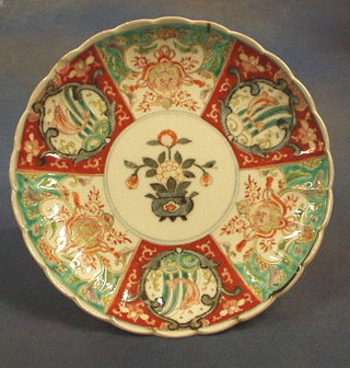 A 19th Century Japanese Imari porcelain plate, decorated  flowers within panelled border 10" (chip to rim)
