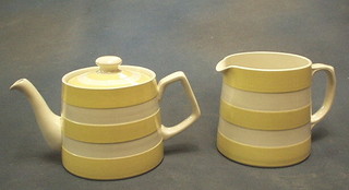 A T G Greener Cornish kitchen ware yellow and white striped teapot and matching jug, the base with green shield mark