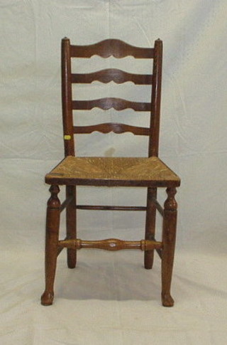 A set of 6 19th Century elm ladder back dining chairs with woven rush seats, on club supports