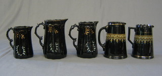 3 graduated black glazed pottery jugs and 3 others