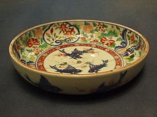 A 19th Century Japanese Imari porcelain bowl decorated fish (f and r) the base with 6 character mark 9"