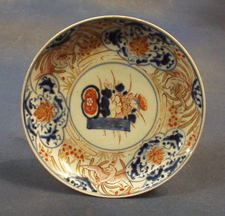 A 19th Century Japanese Imari porcelain circular plate the centre decorated a vase of flowers 7"