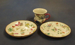 A Japanese Imari porcelain cup and 2 porcelain saucers (chipped)