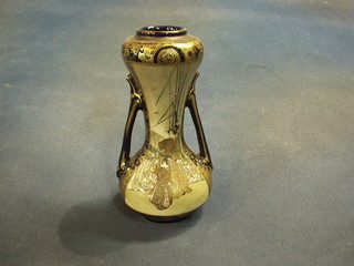 A late 19th Century Japanese Satsuma porcelain twin handled vase of waisted form decorated Geishas 8"