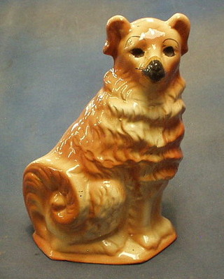 A Staffordshire figure of a seated dog 13" (eyes missing)