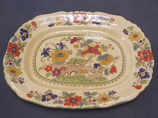 A set of 3 Masons Finest Ironstone  graduated china pottery meat plates, painted flowers within a floral border, the bases with brown Masons mark 2631