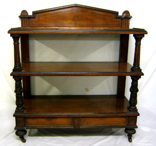 A Victorian oak 3 tier buffet with raised back, the base fitted 2 drawers, raised on turned supports 46"