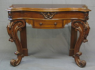 A Continental walnutwood console table of serpentine outline, raised on cabriole supports 52"
