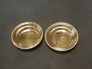 2 circular silver dishes with cast borders 4" Birmingham (marks rubbed) 2 ozs