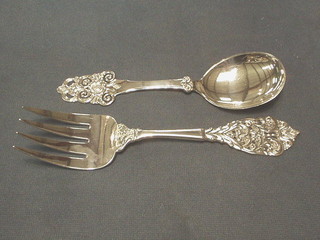 A  pierced "Swedish" silver serving fork and spoon with pierced handle marked 830SMM