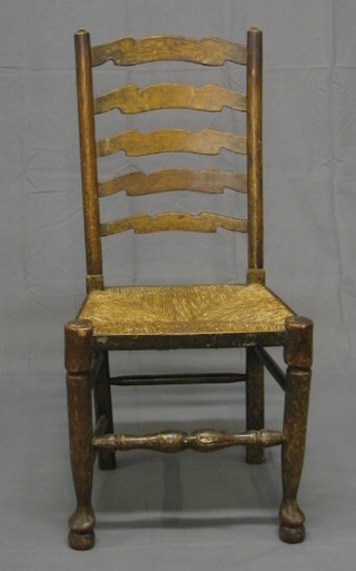 A harlequin set of 12 elm Lancashire ladder back dining chairs with woven rush seats on club supports