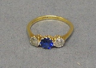 A lady's 18ct gold engagement/dress ring set a sapphire and 2 diamonds