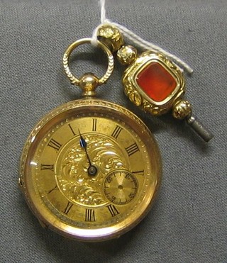 An open faced pocket watch contained in a 14ct gold case together with key