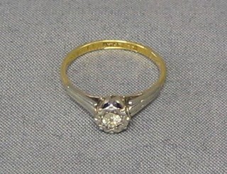 A lady's gold illusion diamond set engagement ring