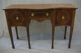 A 19th Century inlaid mahogany, serpentine fronted, sideboard, fitted a drawer flanked by a cupboard and drawer, raised on square tapering supports and spade feet, 48"