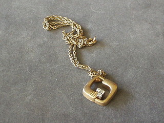 A fine gold chain hung a 9ct gold pendant set 3 diamonds