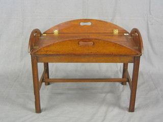 A 19th Century mahogany oval folding Butler's tray, raised on a stand, 29"