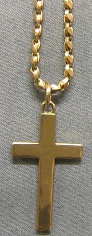 A 9ct gold cross hung on a 9ct gold chain