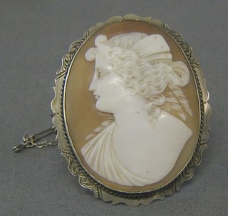A 19th Century shell carved cameo portrait brooch of a lady contained in a "silver" brooch mount