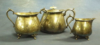A Britannia metal oval engraved 3 piece tea service with teapot, twin handled sugar bowl and cream jug
