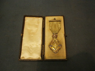 A Victorian 1897 Masonic gilt metal commemorative jewel