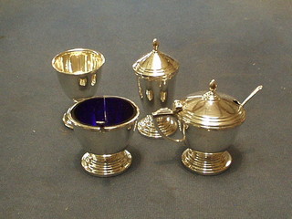 A plain silver 3 piece condiment set comprising mustard pot, pepper pot and salt, Birmingham 1967 and a silver egg cup