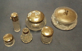 A cut glass Art Deco powder jar with silver lid, Birmingham 1935 and 3 graduated cut glass dressing table jars with silver lids (dents), a Persian phial (dents) and a small perfume bottle (no stopper) (6)