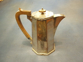 An octagonal silver plated hotwater jug
