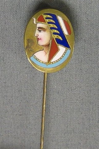 A 19th Century gilt metal and enamel stick pin decorated a Pharaohs' head