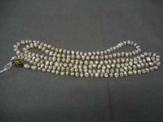 A string of approx. 190 natural pearls with gold and enamel clasp