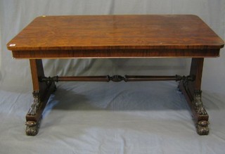 A William IV rosewood library table raised on standard end supports with an H framed stretcher 54"