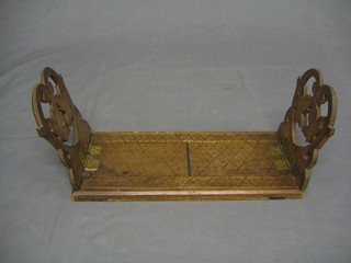 A pair of 19th Century carved oak expanding book ends