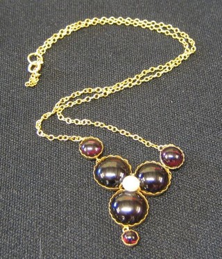 A lady's attractive pendant set 6 cabouchon cut garnets with a pearl to the centre, hung on a fine gold chain