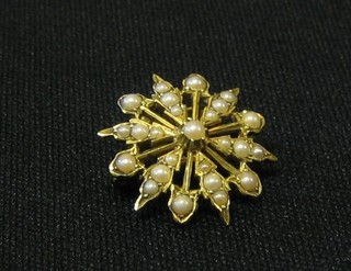 A 19th Century 15ct gold pendant/brooch in the form of a star set pearls