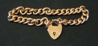 A 9ct gold curb link bracelet with padlock clasp