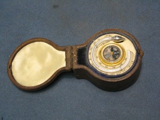 A 19th Century ivory pocket barometer with compass contained in a leather fitted case 2"