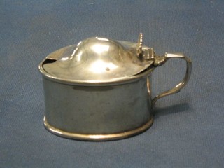 A Georgian style oval silver mustard pot with hinged lid (f) and blue glass liner (f) London 1919