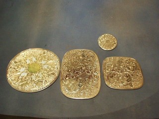 10 circular engraved silver plated place mats together with 6 coasters